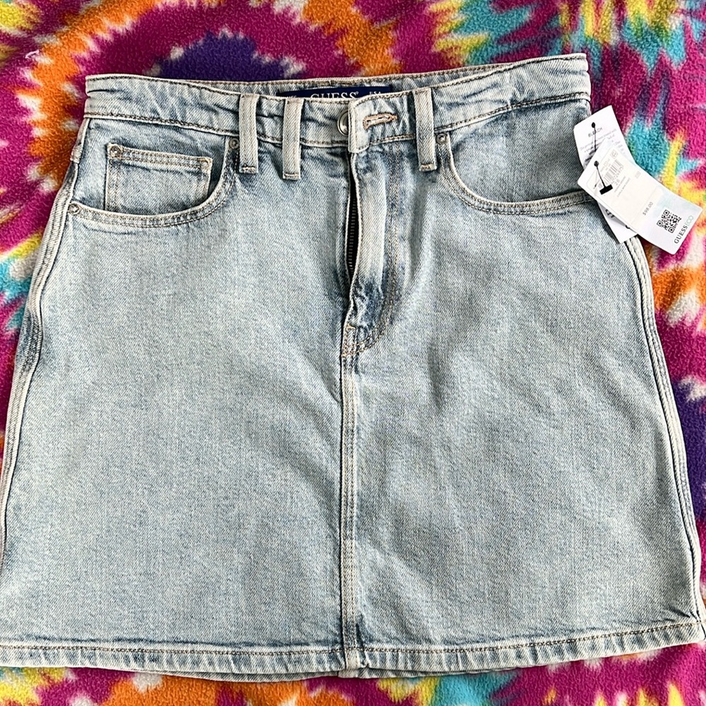 Faded denim skirt w stretch built in.  Comfy cute modern style short skirt